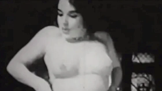 Vintage girl with natural tits strips on cam in 50s erotic movie