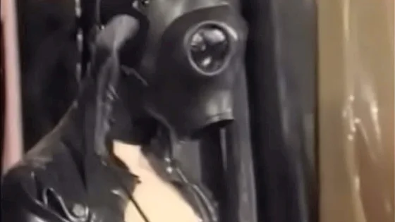 Natalia Muehlhausen latex slave in hood and gasmask gets a good fuck from her master (from 'Gummi in der Ehe')