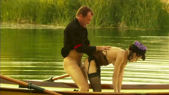This lovely couple banged outdoors in the middle of a lake in a small boat